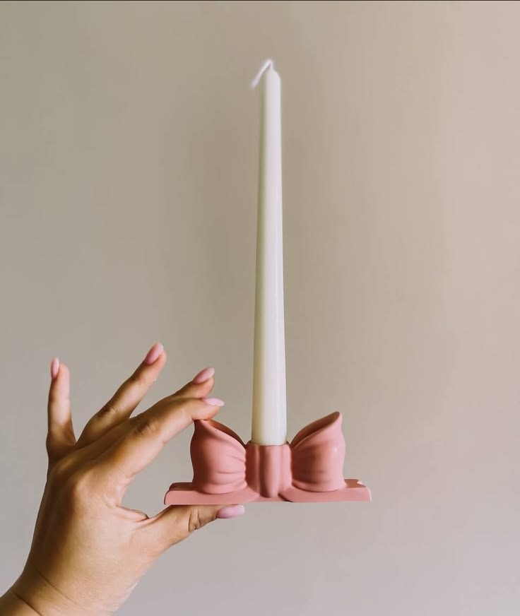 candle with bow candle stand